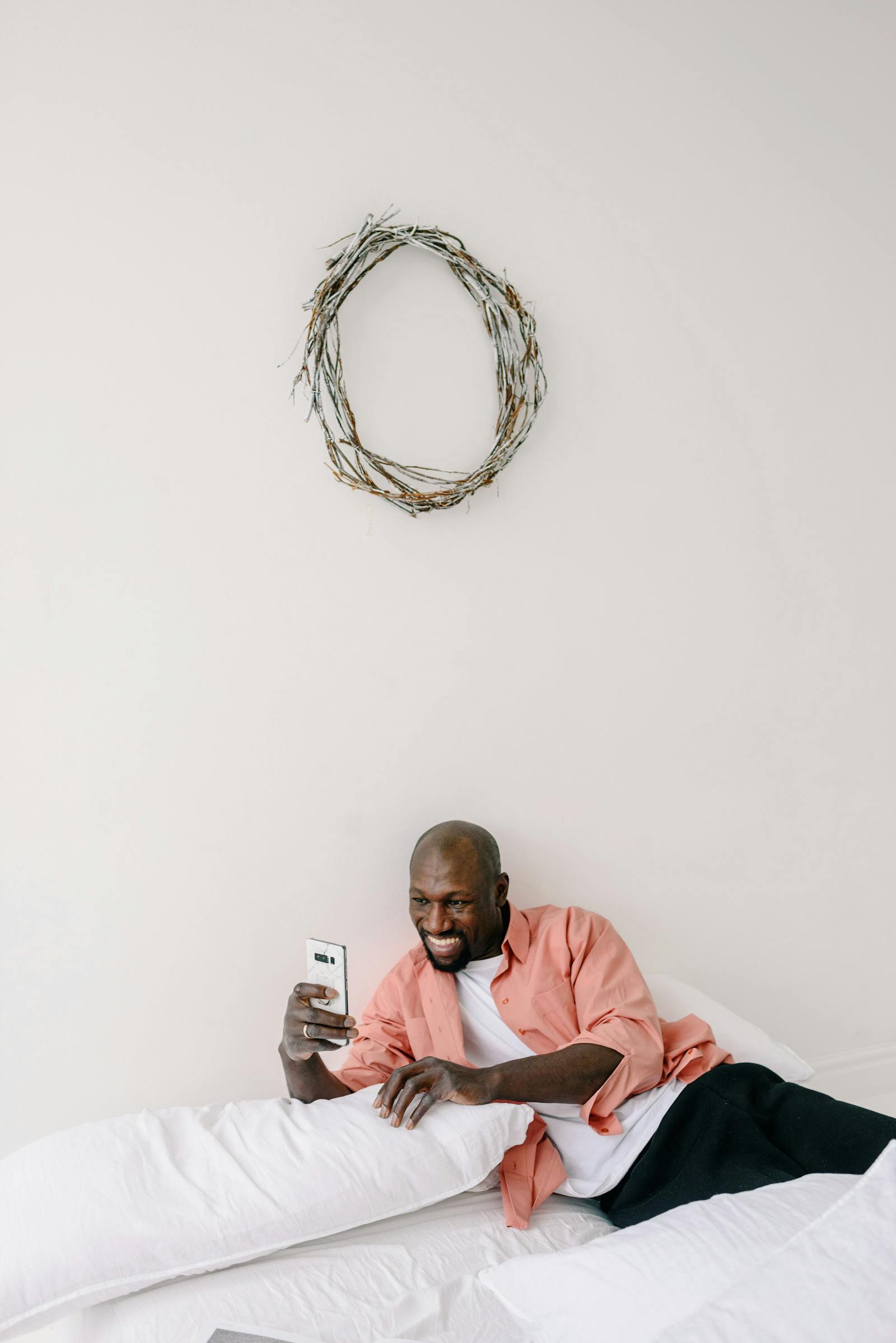 A person reviewing personal finance advice on their phone in a Nigerian setting
